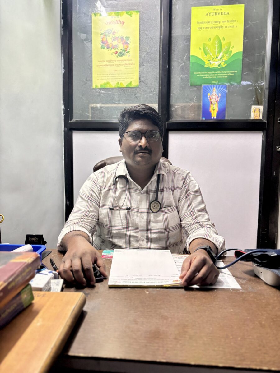 Ayurvedic doctor in pune sitting in his clinic